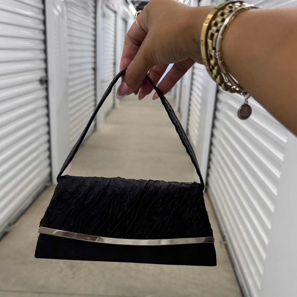 Chic Black Textured Clutch with Silver Accent